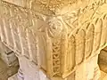 Human face and arcading on font