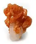 Tinzenite on calcite, 4.5 × 3.5 × 3&nbsp;cm. Wessels Mine, Kalahari manganese fields, Northern Cape Province, South Africa