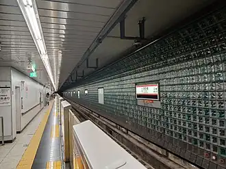 The platform at Akabanebashi Station features glass blocks and tiles made in Italy embedded in the walls.