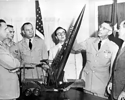 U.S. Army Major General Holger N. Toftoy examining a model of the Sergeant missile.