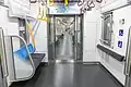 Priority seating interior view of the Tokyo Metro 17000 series, featuring a wheelchair space