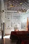 The shrine's interior is decorated with extensive mirror-work known as āina-kāri