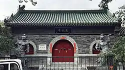 A grey temple building