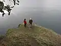 Two onlookers at a viewpoint in the park