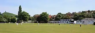 Cricket being played at Morlands Athletic Ground