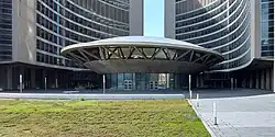 open space with vegetation in front of building