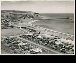 Image 1Rapid Bay, South Australia in 1950 with its limestone quarry and jetty for loading limestone onto ships (from Transport in South Australia)