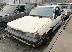 An abandoned Toyota Carina in China (T150, pre-facelift)