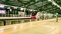 Mumbai Metro train arriving at Azad Nagar
