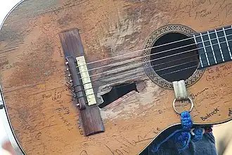 Willie Nelson's guitar, Trigger, has been signed by several of Nelson's friends