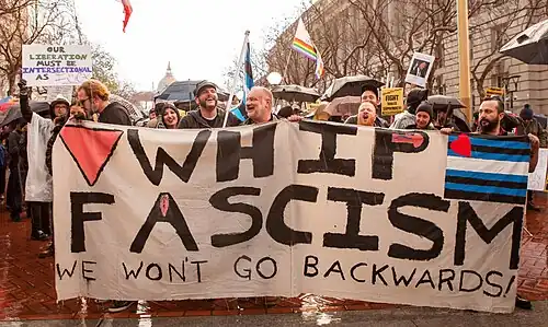 Pink triangle on a protest banner calling Trump a fascist, in San Francisco in 2017