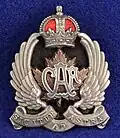 Officer's cap badge for the wedge hat from the 2nd issue (with motto) c. 1920