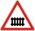 Railway crossing ahead that is protected by automatic gates