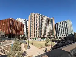A photo of modern high-rises—Umoja, Alianza, and Malk Hall—at Thurgood Marshall College.