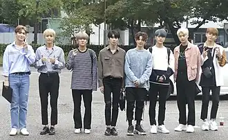 Up10tion at KBS Music Bank in 2019 L–R: Gyujin, Sunyoul, Hwanhee, Xiao, Jinhoo, Bitto, Kogyeol and Kuhn
