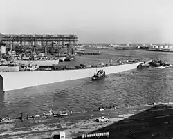 An incomplete warship hull following launch