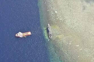 The USS Guardian aground as seen from above