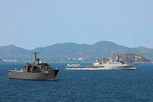 RSS Resolution passes alongside USS Denver on 20 February 2011.