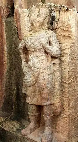 Warrior wearing Achkan or long coat or chiton, and boots from Udayagiri and Khandagiri Caves, Orissa, 2nd century BCE[10]