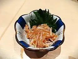 Finely chopped shark cartilage dressed with pickled plum paste.