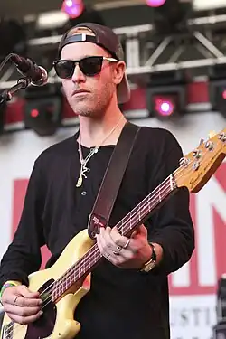 Portrait performing with Unknown Mortal Orchestra in 2013