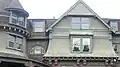 Note the concentric arcs of the gable's shingles