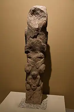 Sculptured totem with human figures