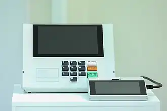 Brazil's DRE voting machine with its terminal for poll assistance volunteers used in all elections since 2000
