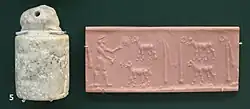 The 'Priest-King' feeding flower to a flock of sheep; standards associated to Inanna. British Museum.