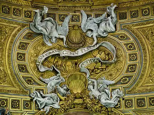 Ut in nomine Jesu omne genu flectatur coelestium, terrestrium et infernorum[7] Raggi and Retti, design by Baciccio. Vault of Gesù, Rome.