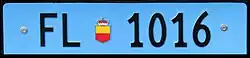 Liechtenstein rear license plate in a long format of 500 × 110 mm. License plates with a light blue background are used for utility vehicles and trailers, with numbers from 21 to 2000.