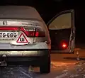 Russian "studded tire" warning with Cyrillic letter Ш "Sha" in a red triangle.