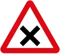 Intersection ahead in which priority must be given to vehicles on the right.