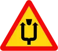 W.246a: Median strip ahead - pass on either side