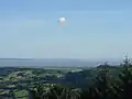 View from Twmbarlwm over the Bristol Channel towards England. Brean Down is in the centre of the photo. Weston-super-Mare is out of sight in the bay to the left of Brean Down.