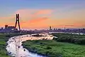 View of New Taipei Bridge and sunset skyline of Taipei in 2014.