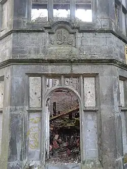 Rear bay of the garden façade, constructed in 1888 with Johnson family crest