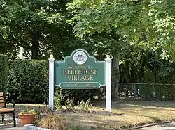 A village welcome sign at the Bellerose station in August 2022