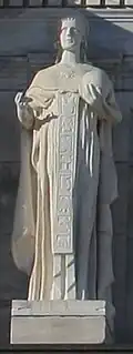 Marble statue of person holding globe
