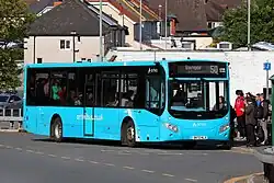 A lime colored Volvo B8RLE with MCV Evora body, operated by Arriva Wales