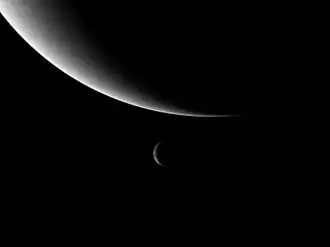 Image 11Neptune and its moon Triton, taken by Voyager 2. Triton's orbit will eventually take it within Neptune's Roche limit, tearing it apart and possibly forming a new ring system. (from Formation and evolution of the Solar System)