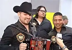 Voz de Mando interviewed by Dulce Osuna in 2013. Left to right: Jorge Gaxiola, Miguel Gaxiola, Carlos "Charly" Sigala.