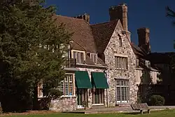 South-facing view of Hartford Hall, an English Tudor-style mansion