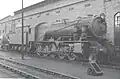 WD 2-10-0 WD 601 "Kitchener" at Carlisle Kingmoor BR shed in 1958. Note air pumps, headlight and nameplate