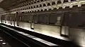 WMATA Rohr Money Train 8000–8001 (former car numbers 1010–1011) bypassing Pentagon City station. These cars were not rehabilitated along with 8002–8003 (former car numbers 1044–1045) and retain their original roll signs, and door chimes. These cars were retired in March 2018.