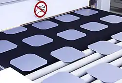 Solar wafers on a conveyor