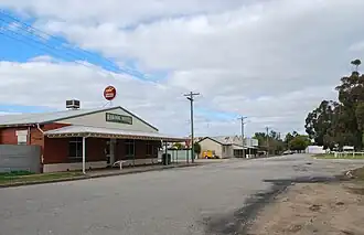 The main street of Wakool, looking south towards the general store. The Wakool Hotel is in the foreground.