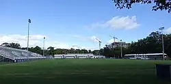 A soccer field surrounded by temporary seating.