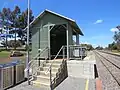Small platform with metal shelter