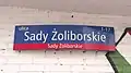 Street sign with Sady Żoliborskie Street and area written on it
